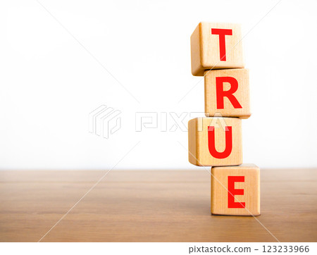 True symbol. Concept word True on beautiful wooden blocks. Beautiful wooden table white background. Business, lifestyle, support and true concept. Copy space. True symbol. Concept word True on beautiful wooden blocks. Beautiful wooden table white background. Business, lifestyle, support and true concept. Copy space. 123233966