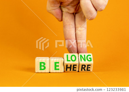 Belonging and belong symbol. Concept words Be here Belong on beautiful wooden block. Beautiful orange background Businessman hand. Business motivational belonging and belong concept. Copy space. Belonging and belong symbol. Concept words Be here Belong on beautiful wooden block. Beautiful orange background Businessman hand. Business motivational belonging and belong concept. Copy space. 123233981