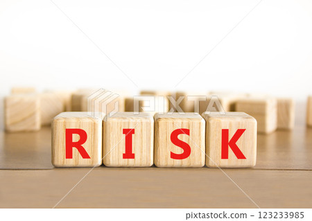 Risk symbol. Concept word Risk on beautiful wooden blocks. Beautiful wooden table white background. Business, lifestyle, support and risk concept. Copy space. 123233985