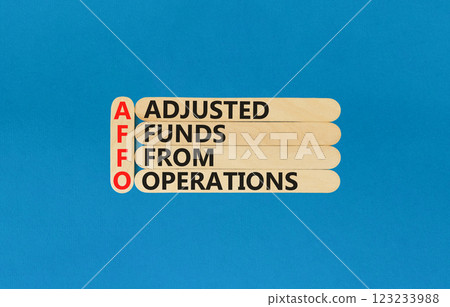 AFFO symbol. Concept word AFFO Adjusted Funds From Operations on beautiful wooden sticks. Beautiful blue background. Business AFFO Adjusted Funds From Operations concept. Copy space. AFFO symbol. Concept word AFFO Adjusted Funds From Operations on beautiful wooden sticks. Beautiful blue background. Business AFFO Adjusted Funds From Operations concept. Copy space. 123233988