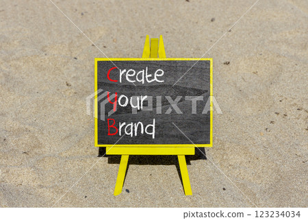 CYB Create your brand symbol. Concept words CYB Create your brand on beautiful yellow blackboard. Beautiful sand background. Business CYB Create your brand concept. Copy space. CYB Create your brand symbol. Concept words CYB Create your brand on beautiful yellow blackboard. Beautiful sand background. Business CYB Create your brand concept. Copy space. 123234034