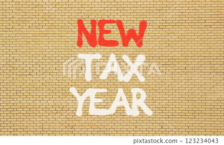 New tax year symbol. Concept words New tax year on beautiful brown brick wall. Beautiful brown brick wall background. Business new tax year concept. Copy space. 123234043