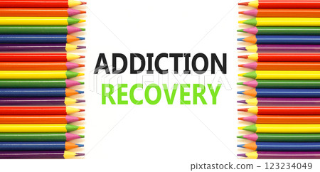 Addiction recovery symbol. Concept words Addiction recovery on beautiful white paper. Colored pencils. Beautiful white paper background. Psychology addiction recovery concept. Copy space. 123234049
