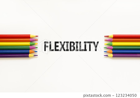 Flexibility symbol. Concept word Flexibility on beautiful white paper. Beautiful white paper background. Beautiful colored pencils. Business flexibility concept. Copy space. Flexibility symbol. Concept word Flexibility on beautiful white paper. Beautiful white paper background. Beautiful colored pencils. Business flexibility concept. Copy space. 123234050