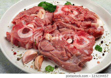 raw steak, calf's neck on the bone, fresh meat, on a white plate, top view, no people, 123234457