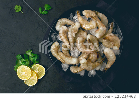Frozen raw shrimp vannamey, on wooden skewers, ice cubes and lime slices, top view, no people, Frozen raw shrimp vannamey, on wooden skewers, ice cubes and lime slices, top view, no people, 123234468