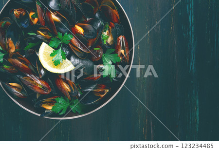 Fresh, Boiled mussels, Black Sea, with parsley and lemon, no people, top view Fresh, Boiled mussels, Black Sea, with parsley and lemon, no people, top view 123234485