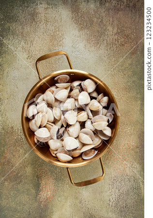freshly frozen vongole clams, in a frying pan, top view, no people, 123234500