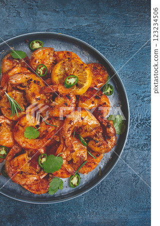 grilled shrimp, unpeeled, headless, with spices, on a dark blue table, homemade, no people, 123234506