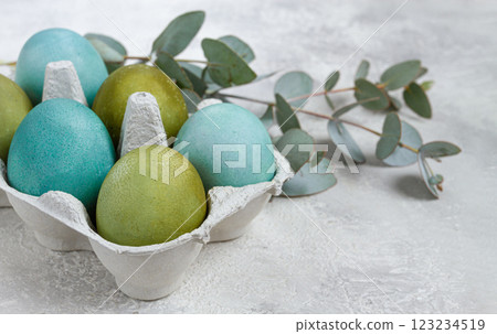 Easter colored eggs, in green and turquoise tones, with eucalyptus leaves, Easter card, top view, no people, Easter colored eggs, in green and turquoise tones, with eucalyptus leaves, Easter card, top view, no people, 123234519