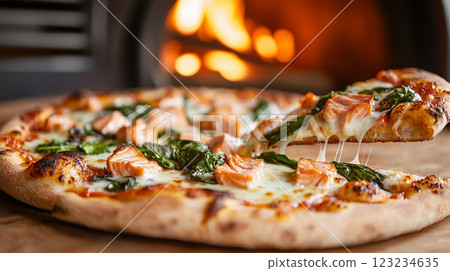 delicious pizza with salmon and vegetables on the background of the oven with fire 123234635