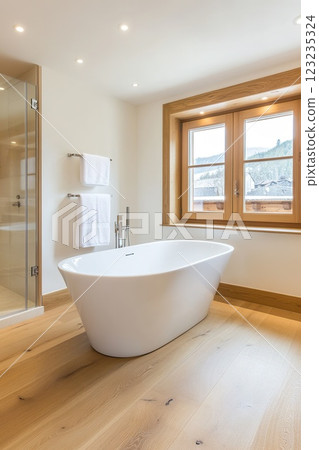 Modern bathroom interior with freestanding bathtub and wooden floor. 123235324
