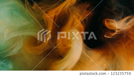 Color mist wave. Ink water splash. Orange green explosion vapor floating flow on dark black dust particles texture abstract art background. 123235759