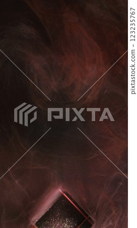 Smoke veil. Mysterious fume. Smooth swirls curls on night abstract background. Atmospheric ink flow of brown gaseous streams glass cube water blur effect. Smoke veil. Mysterious fume. Smooth swirls curls on night abstract background. Atmospheric ink flow of brown gaseous streams glass cube water blur effect. 123235767