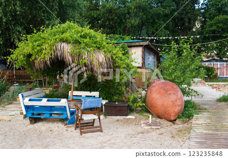 Sitting area in a fishing village on the seashore - concept of rest and sea life 123235848