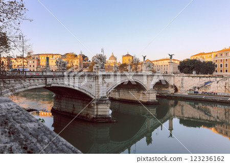 Rome in morning. Panoramic view of Ponte Sant Angelo Bridge in Rome with reflection in Tiber river. 123236162