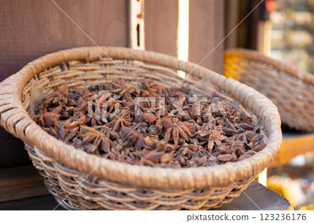Traditional spices market. Pots and wooden tubs stand with star anise spice. Street bazaar. Dubai, UAE.  123236176
