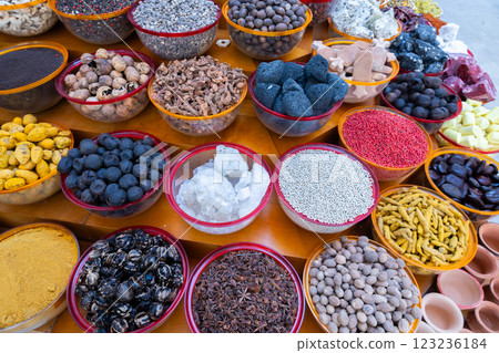 Traditional spices market. Pots and wooden tubs stand in row with colorful tea, spices, fruits, roots, flowers. Street bazaar. Dubai, UAE. Traditional spices market. Pots and wooden tubs stand in row with colorful tea, spices, fruits, roots, flowers. Street bazaar. Dubai, UAE. 123236184