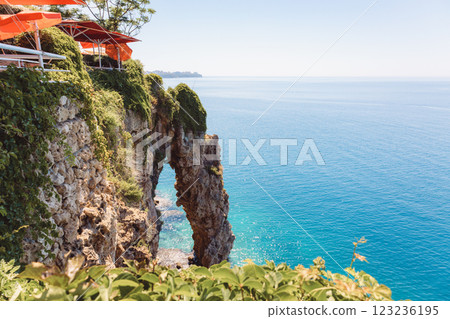Panoramic aerial view of beautiful seascape with cliff. View from Ataturk Park to idyllic azure sea, mountains with vegetation and blue water, Antalya, Turkey. High quality photo Panoramic aerial view of beautiful seascape with cliff. View from Ataturk Park to idyllic azure sea, mountains with vegetation and blue water, Antalya, Turkey. High quality photo 123236195
