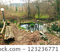 recreation area with a pond in the park 123236771