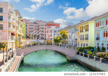 Qanat Quartier Venetian copy luxury residential district with authentic colorful apartment buildings and water channel with bridge, Pearl Island, Doha, Qatar 123237463
