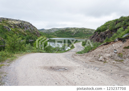 Gravel road in rocky tundra 123237708
