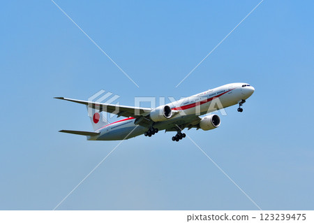 A government plane flying in the blue sky A government plane flying in the blue sky 123239475