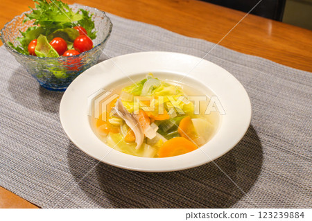 A table filled with vegetable soups and salads A table filled with vegetable soups and salads 123239884