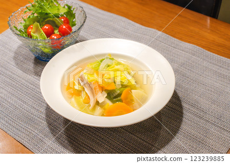 A table filled with vegetable soups and salads 123239885