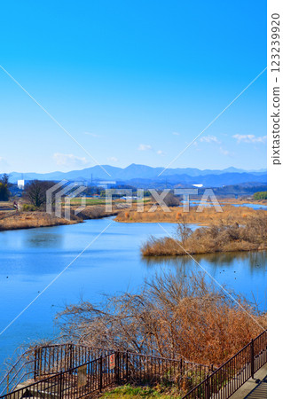 Beautiful scenery of the main stream of the Arakawa River, mountain ranges in the Chichibu area, near Rokuseki Headworks in Fukaya City Beautiful scenery of the main stream of the Arakawa River, mountain ranges in the Chichibu area, near Rokuseki Headworks in Fukaya City 123239920