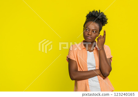 African American woman thoughtful gesture finger to temple deep focus seeking solution, inspiration 123240165