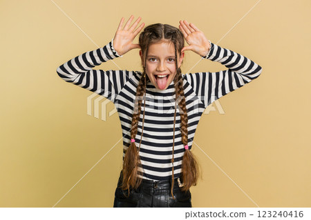 Cheerful funny bully child girl showing tongue making silly faces, fooling around, joking, teasing Cheerful funny bully child girl showing tongue making silly faces, fooling around, joking, teasing 123240416