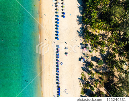 Summer seascape beautiful waves,Tropical sea water in sunny day, Top view from drone camera,Amazing ocean colorful nature background, Beautiful bright sea waves splashing on beach sand 123240881