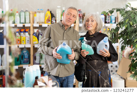 Senior spouses studies label and choose kitchen cleaner spray and liquid detergent 123241277