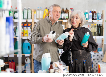 Husband and wife choose shampoo and shower gel 123241322