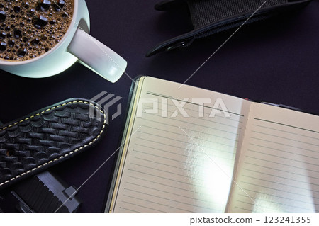 A flashlight and notebook on a navy blue uniform A flashlight and notebook on a navy blue uniform 123241355