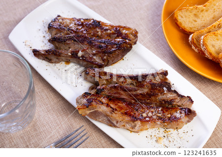 Fried piece of veal served on platter Fried piece of veal served on platter 123241635