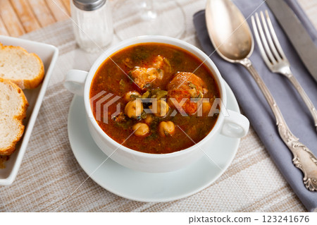 Traditional Spanish soup with beans, chickpeas and meat 123241676