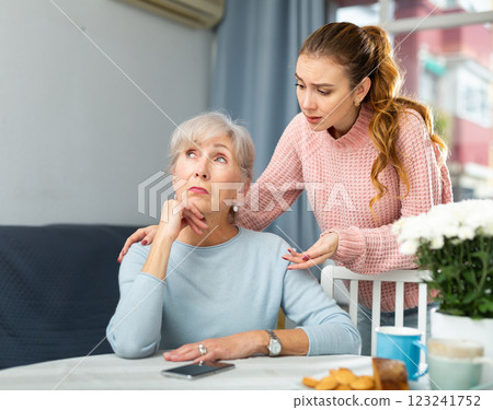 Young woman encouraging her upset mother 123241752