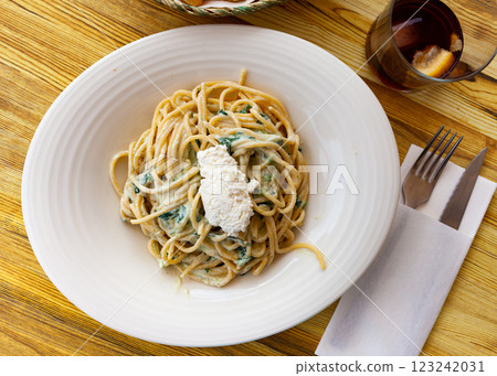 Spanish cuisine spinach pasta served with ricotta cheese 123242031