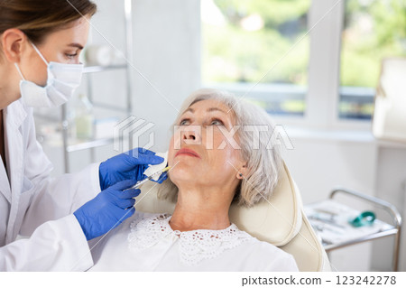 Facial injection mature patient Facial injection mature patient 123242278