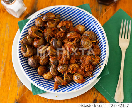Shellfish snail cooked with minced meat and tomato dressing 123242357