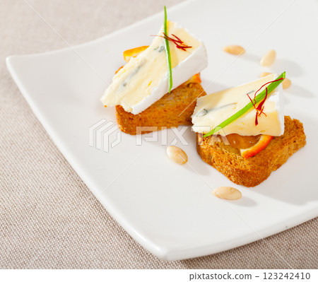 Canape with soft blue cheese Canape with soft blue cheese 123242410