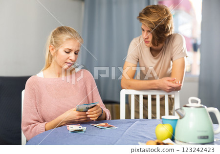 Mother giving some cash her teenager son 123242423