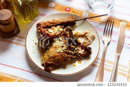 Baked lamb with kebab on wooden skewer and yogurt dip 123242432