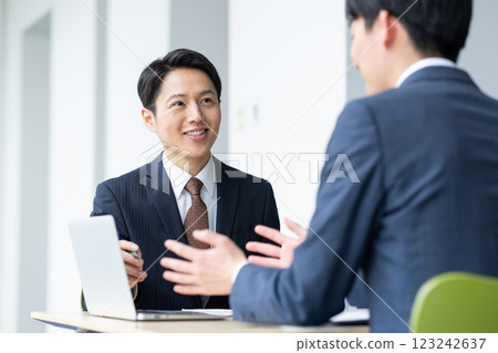 Businessmen having a meeting. Photo courtesy of Sky Perfect TV Tokyo Media Center. 123242637