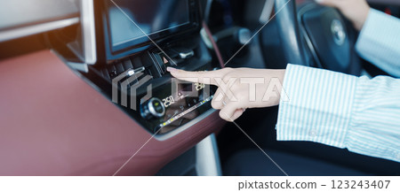 Finger presses the emergency stop button inside the car. Safety and transportation concept 123243407