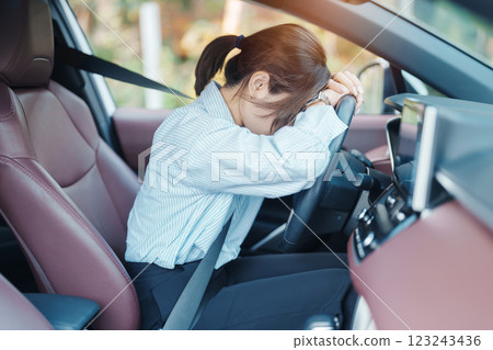 woman feeling stress and angry during drive car long time. Asian girl tired and fatigue having headache after driving car in traffic jam. Sleepy, stretching and drunk concept woman feeling stress and angry during drive car long time. Asian girl tired and fatigue having headache after driving car in traffic jam. Sleepy, stretching and drunk concept 123243436