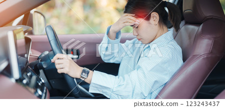 woman feeling stress and angry during drive car long time. Asian girl tired and fatigue having headache after driving car in traffic jam. Sleepy, stretching and drunk concept woman feeling stress and angry during drive car long time. Asian girl tired and fatigue having headache after driving car in traffic jam. Sleepy, stretching and drunk concept 123243437