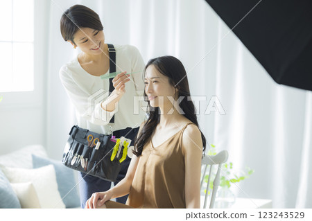 Photographer, model, hair and makeup photoshoot Photographer, model, hair and makeup photoshoot 123243529